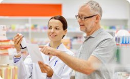 pharmacist assisting her elderly patient