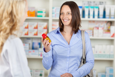 customer holding a bottle of medicine